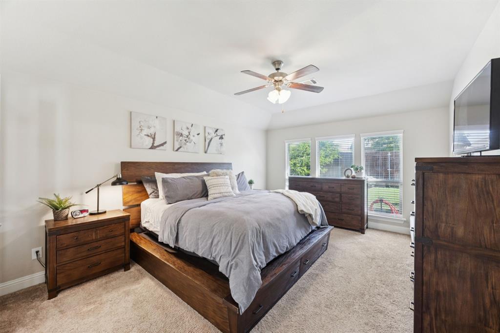 4017 Netherfield Road Frisco, TX 75036 - Photo 13 of 29 a bedroom with a bed dresser and a window