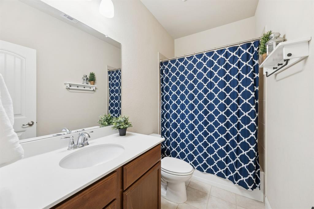 4017 Netherfield Road Frisco, TX 75036 - Photo 18 of 29 a bathroom with a sink and a toilet