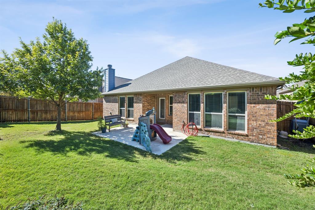 4017 Netherfield Road Frisco, TX 75036 - Photo 21 of 29 a view of a house with a yard and sitting area
