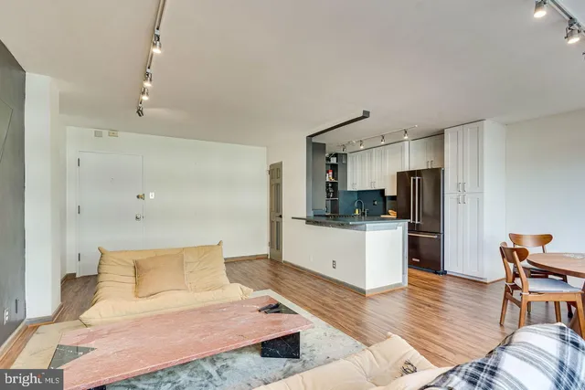 a large bedroom with a bed and furniture