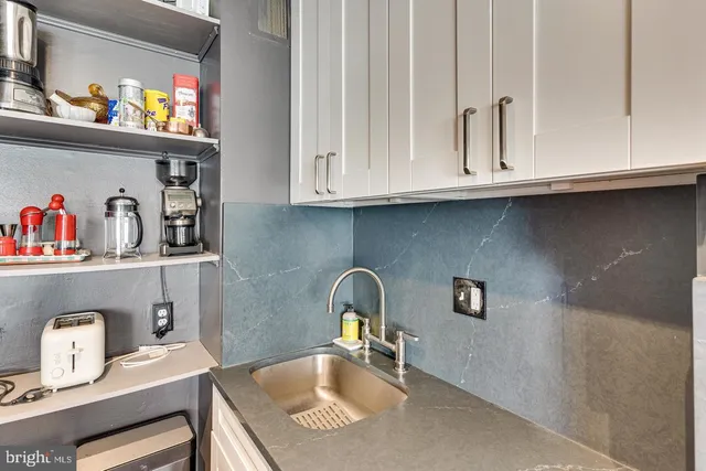 a bathroom with a sink and a window