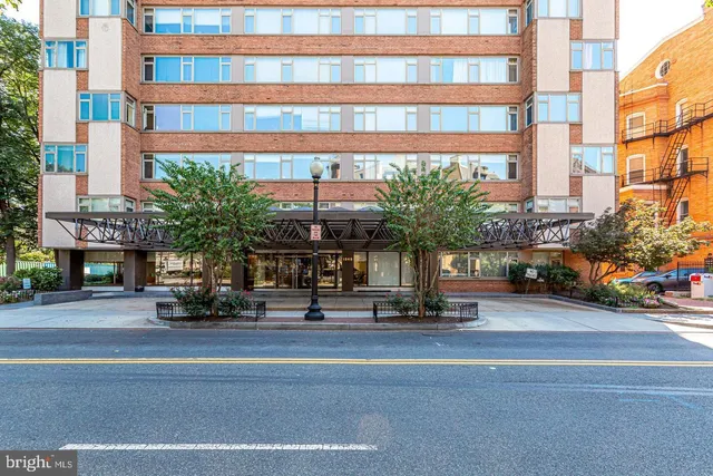 a building with a potted plant on the side of it