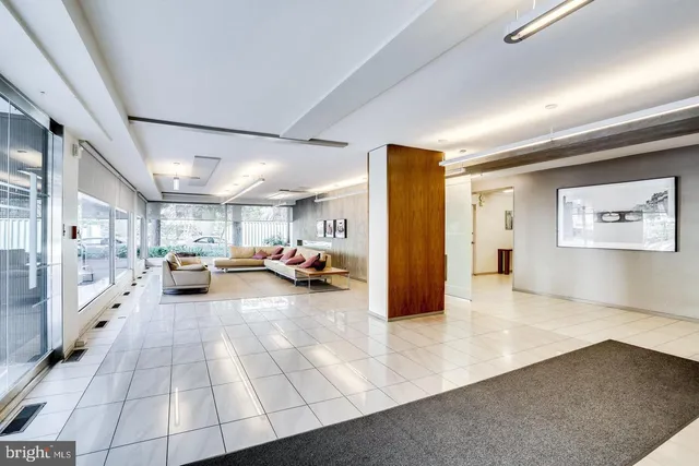 a view of a livingroom with furniture and a ceiling fan