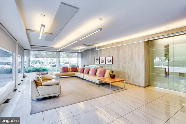 a living room with furniture and a large window