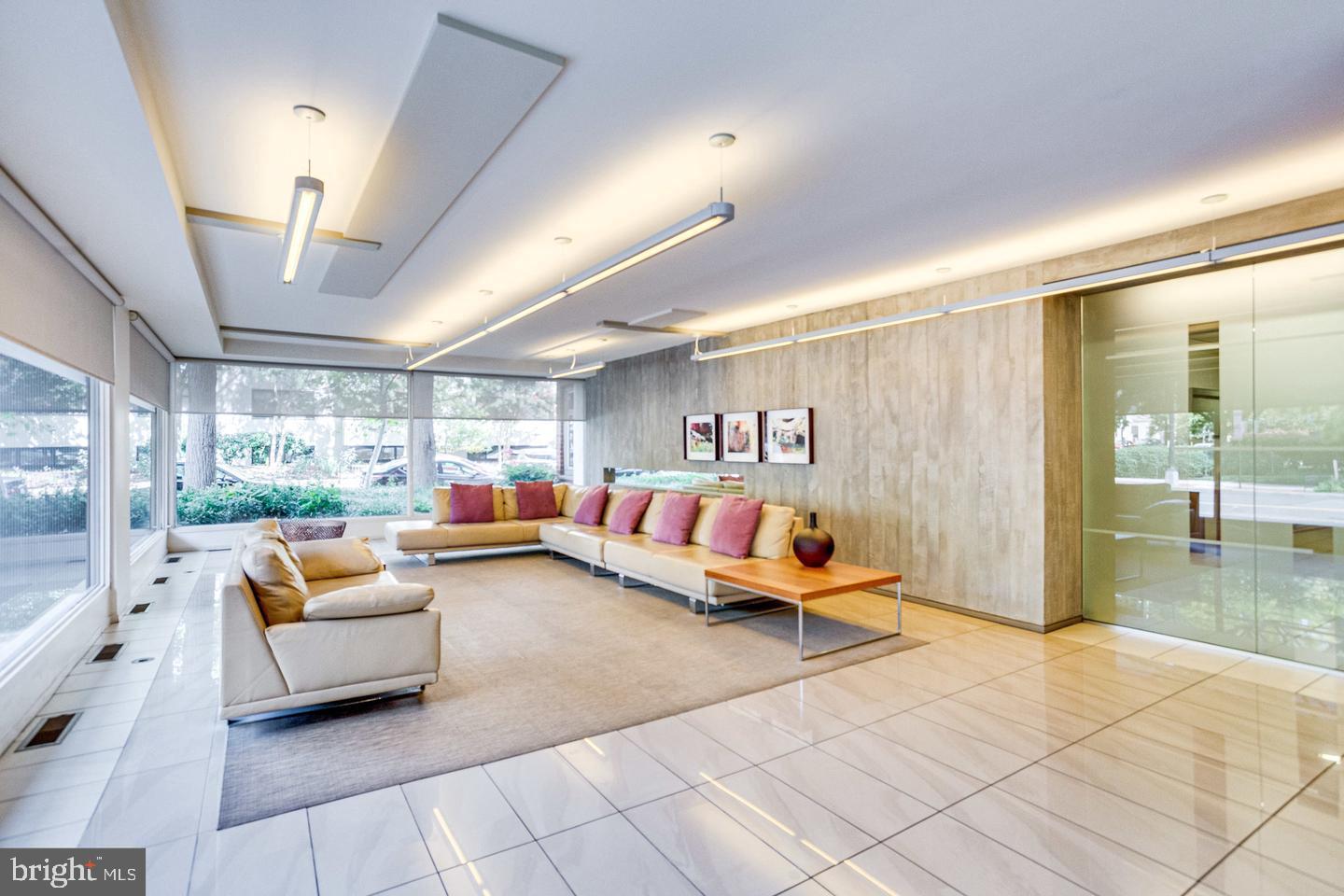 1545 18th Street Northwest, Unit 403 Washington, DC 20036 - Photo 6 of 44 a living room with furniture and a large window