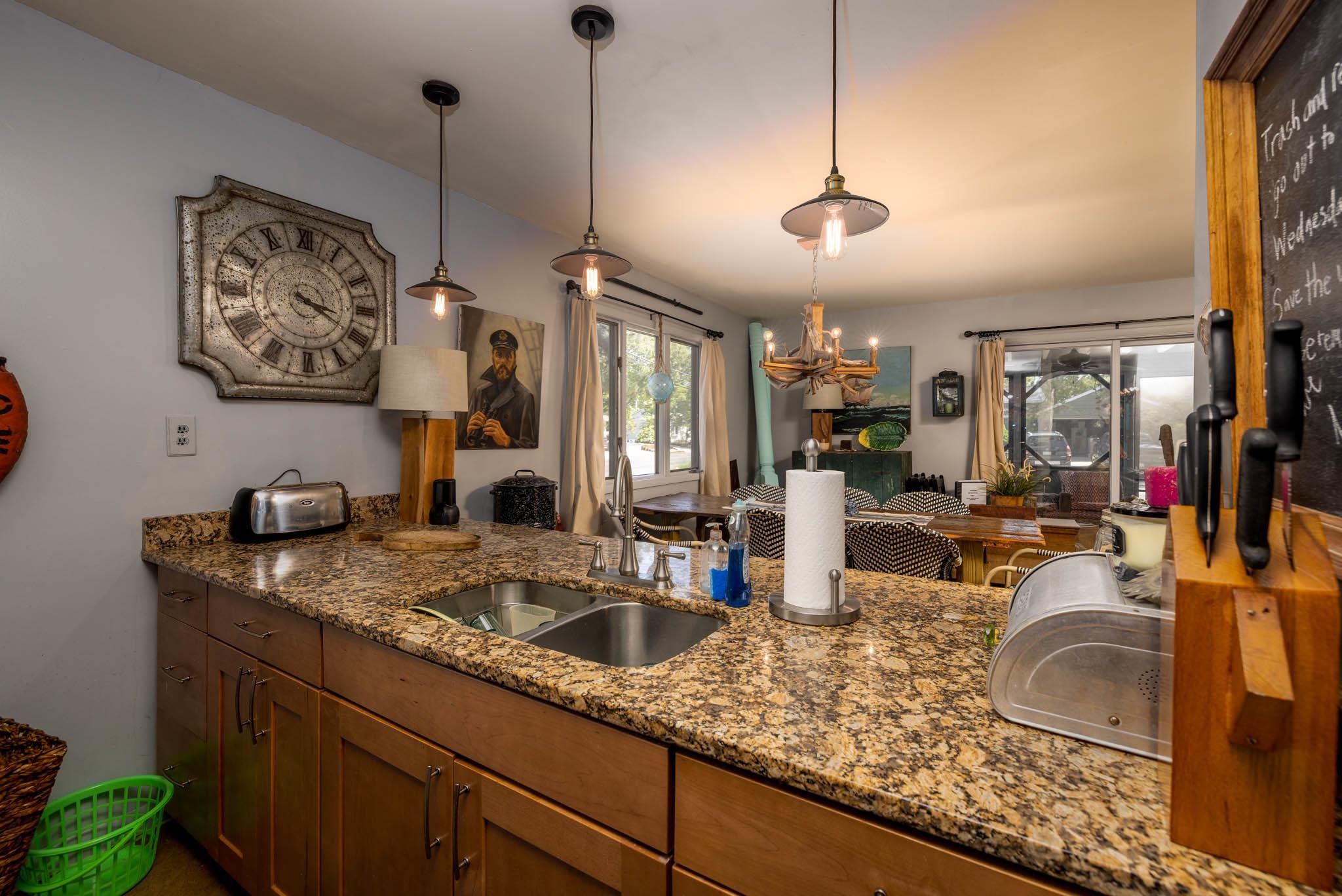 29 Cedarbrook Road Cape May, NJ 08204 - Photo 12 of 28 a kitchen with sink and living room view