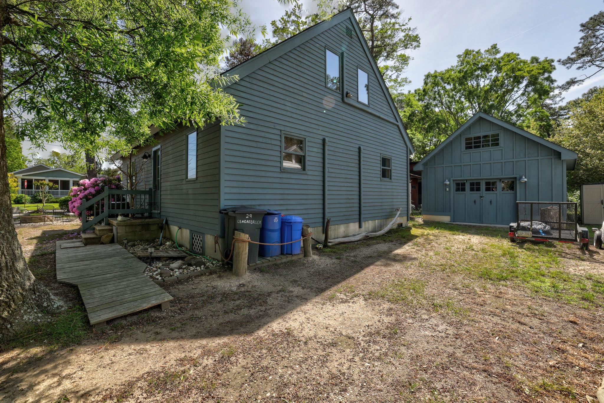 29 Cedarbrook Road Cape May, NJ 08204 - Photo 22 of 28 a view of a house with a patio and a yard
