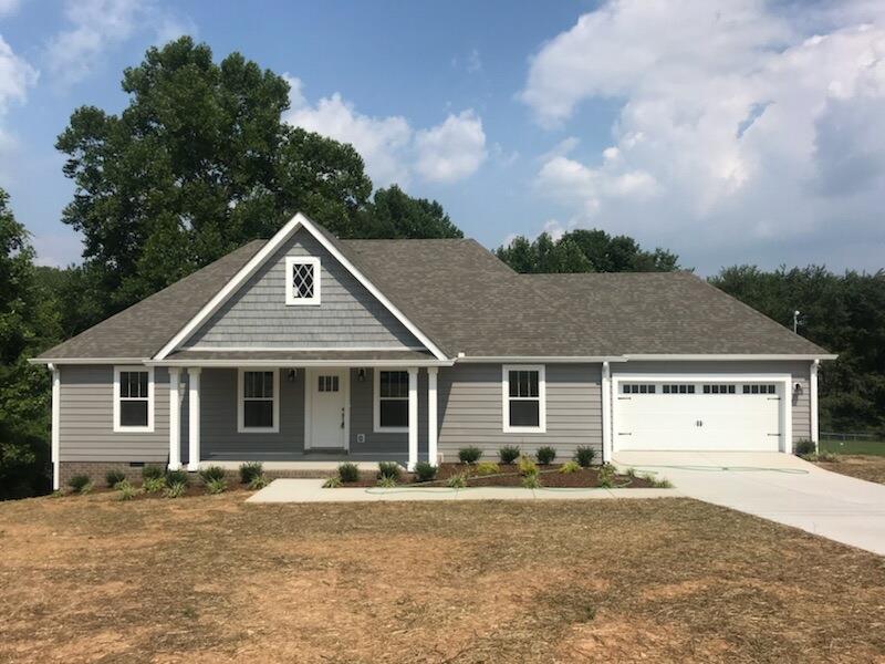 807 Blakemore Road Dickson, TN 37055 - Photo 1 of 26 a front view of a house with a yard