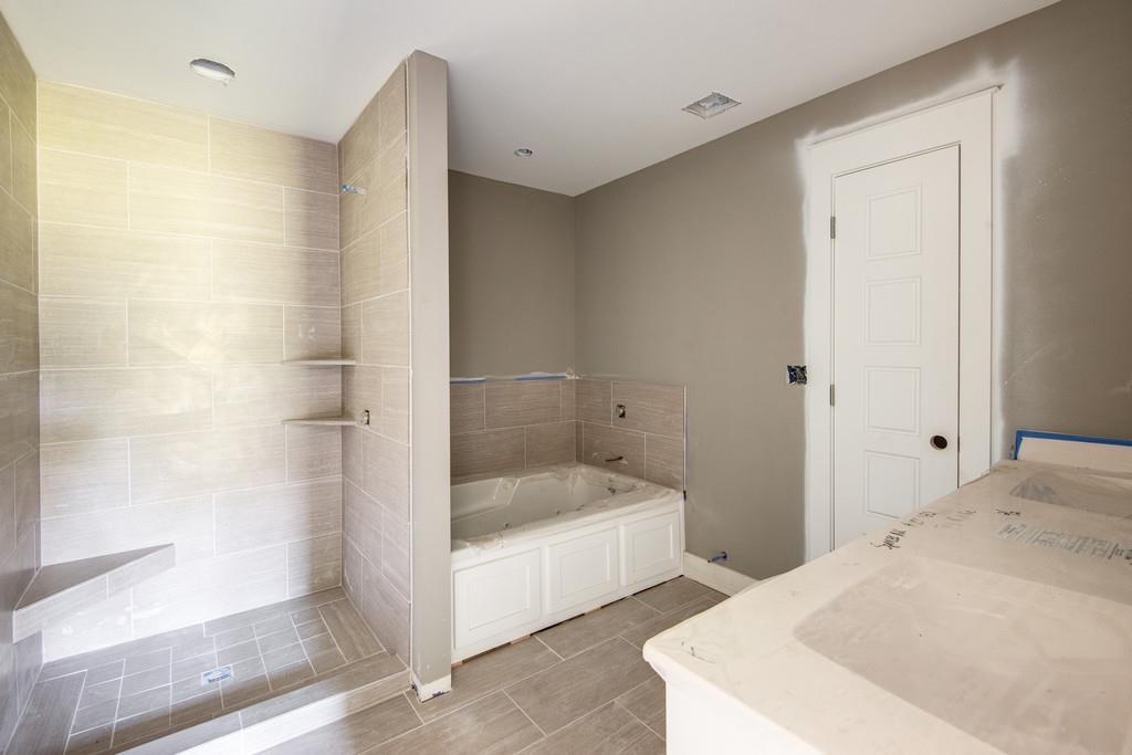 807 Blakemore Road Dickson, TN 37055 - Photo 13 of 26 a bathroom with a bathtub and a shower