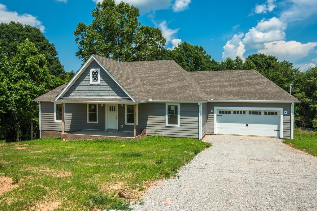 807 Blakemore Road Dickson, TN 37055 - Photo 14 of 26 a front view of a house with a yard