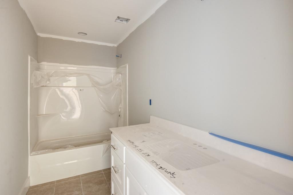 807 Blakemore Road Dickson, TN 37055 - Photo 19 of 26 a bathroom with a bathtub and shower