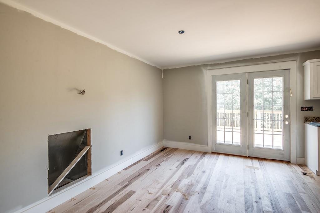 807 Blakemore Road Dickson, TN 37055 - Photo 9 of 26 a view of an empty room with wooden floor and a window