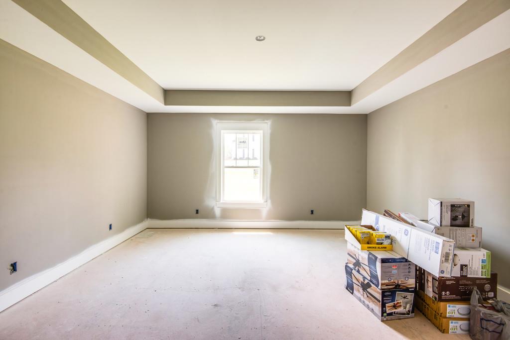 807 Blakemore Road Dickson, TN 37055 - Photo 10 of 26 a view of an empty room with furniture and a window