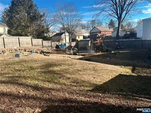 a view of a yard with a tree