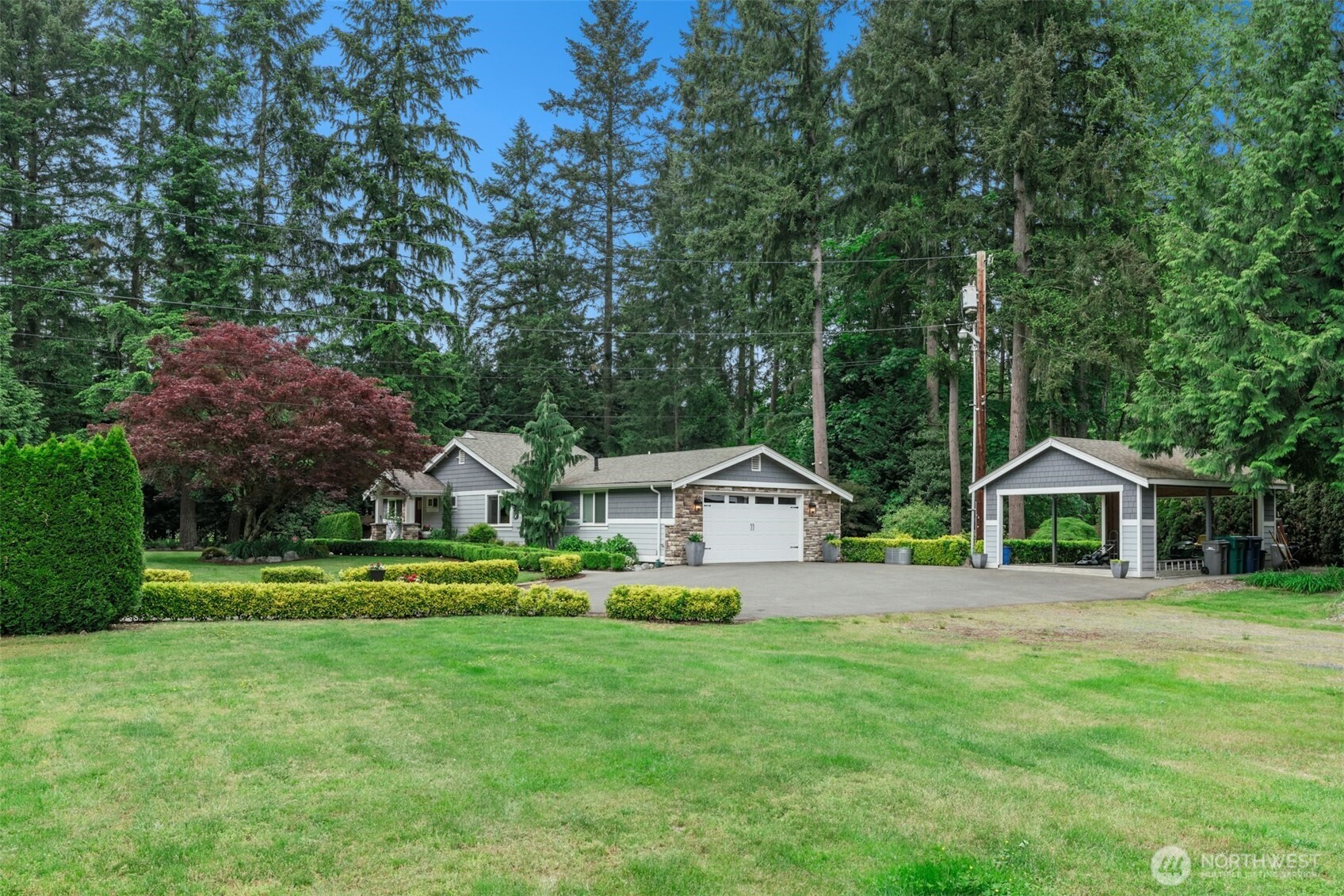23307 49th Avenue Southeast Bothell, WA 98021 - Photo 2 of 37 a front view of a house with a yard and trees