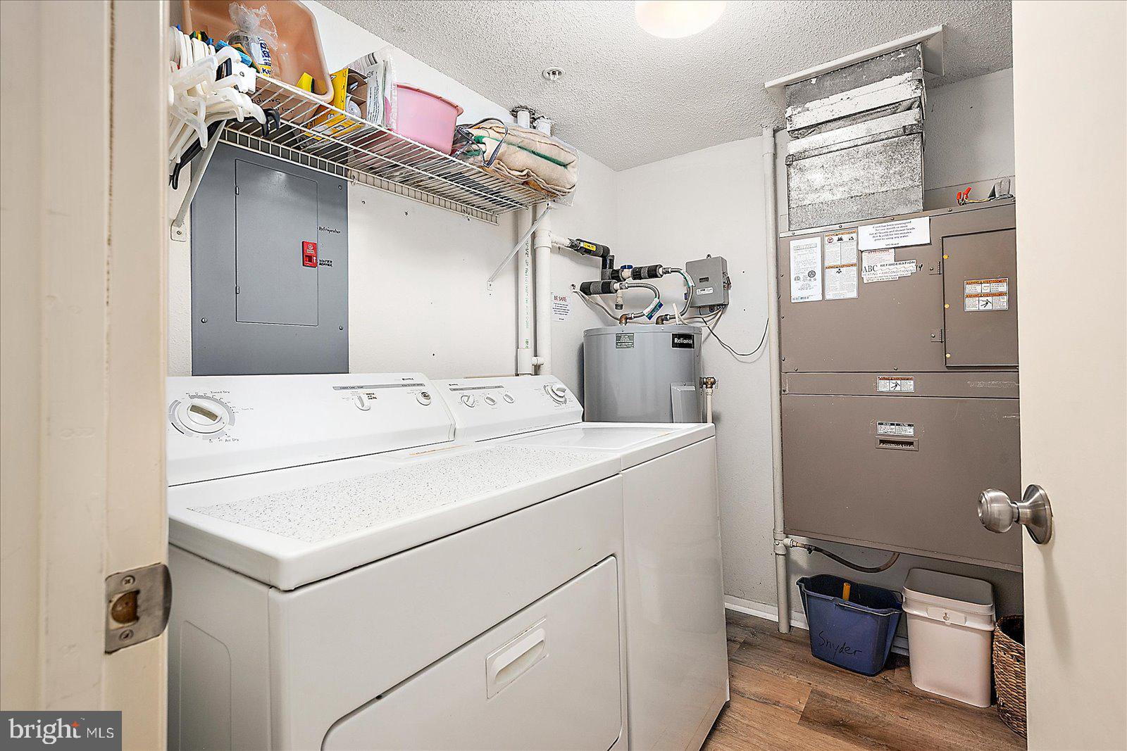 5801 Atlantic Avenue, Unit 101 Ocean City, MD 21842 - Photo 27 of 50 a utility room with dryer and washer