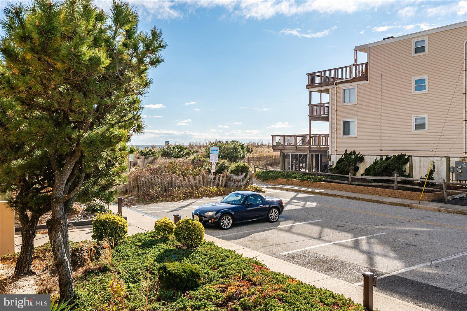 5801 Atlantic Avenue, Unit 101 Ocean City, MD 21842 - Photo 31 of 50 a cars parked in front of a building