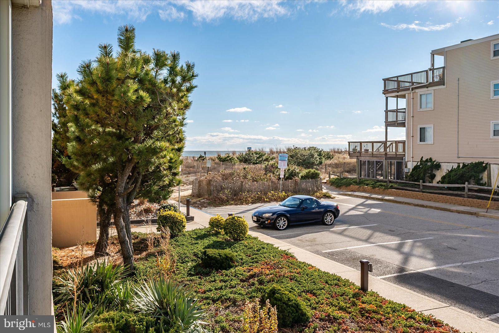 5801 Atlantic Avenue, Unit 101 Ocean City, MD 21842 - Photo 32 of 50 a cars parked on the side of a street