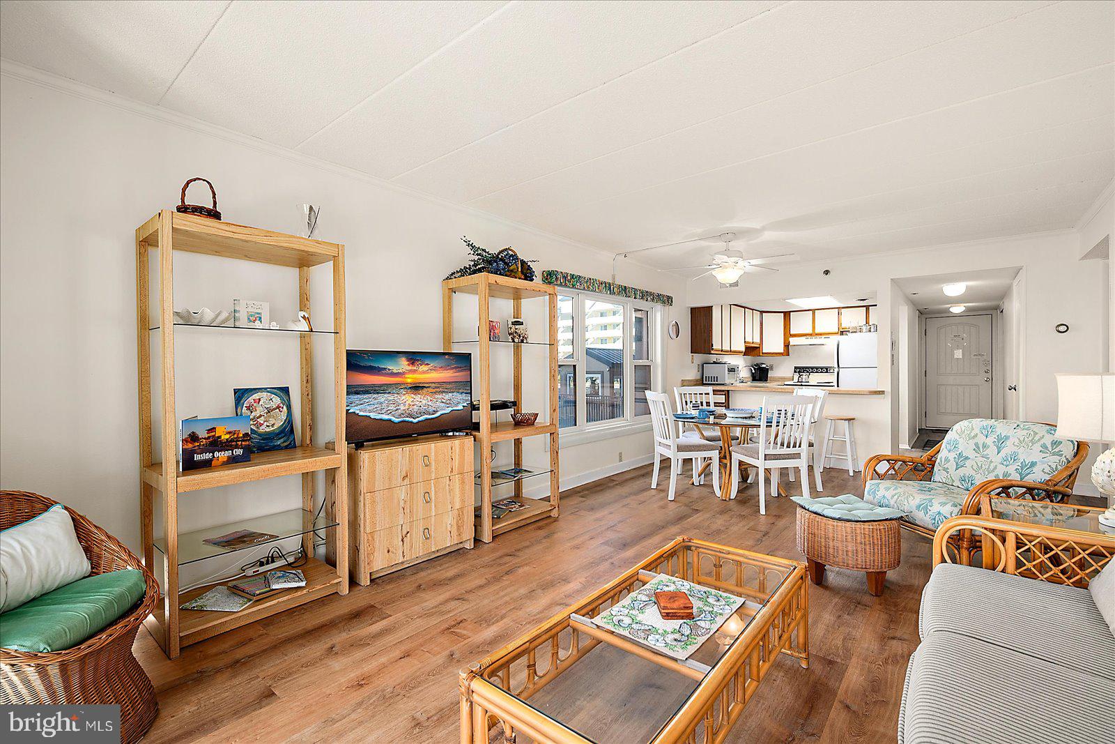5801 Atlantic Avenue, Unit 101 Ocean City, MD 21842 - Photo 9 of 50 a living room with furniture and a wooden floor