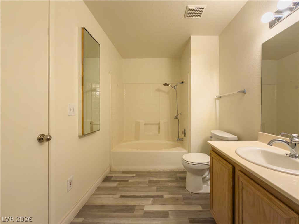 8070 West Russell Road, Unit 2063 Las Vegas, NV 89113 - Photo 7 of 9 Functional primary bathroom features a shower-over-tub combination and sleek vanity.