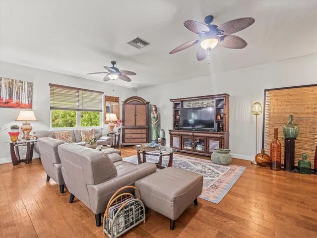 a bedroom with a bed a window and dresser