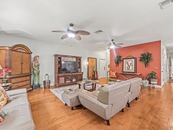 a bed sitting in a bedroom and kitchen