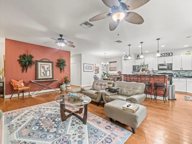 a spacious bathroom with a double vanity sink mirror and a bathtub