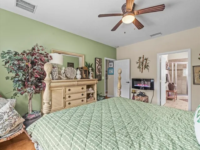 a bedroom with a bed and a couch