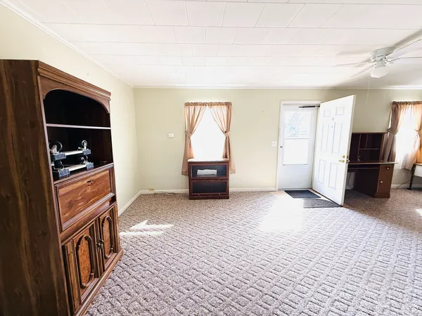 a living room with a couch and a flat screen tv