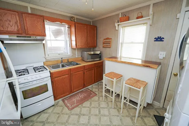 a room with chairs a washer and dryer