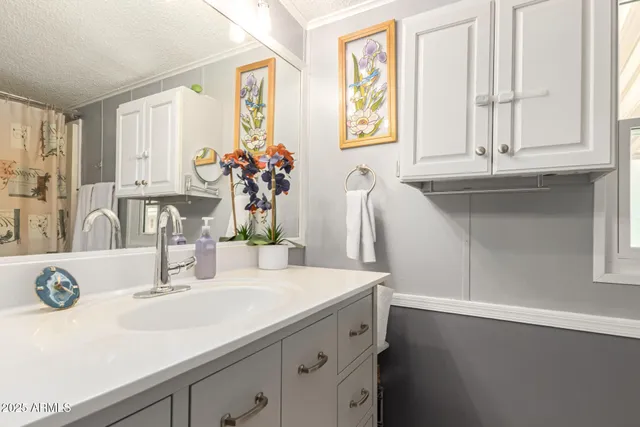 a bathroom with a sink and a window
