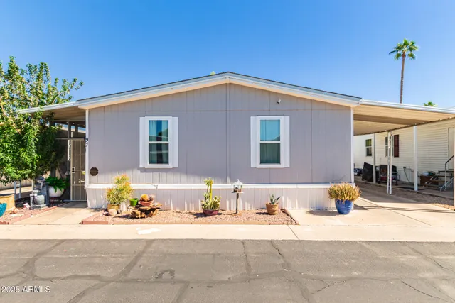 a view of a patio with couches and potted plants