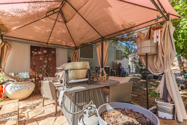 a view of a backyard with sitting area