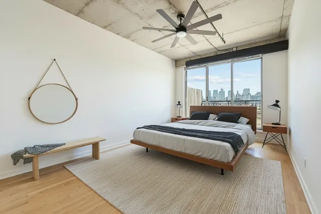 a front view of a building with a garden