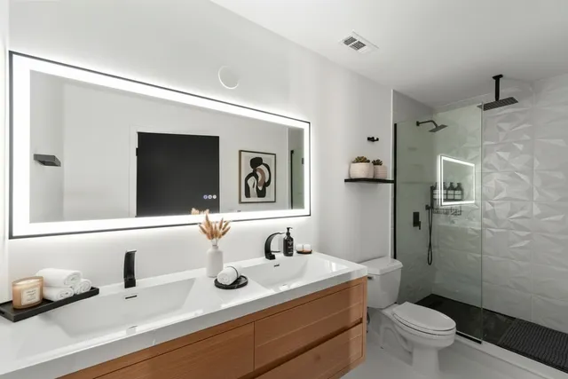 a picture of a wall with a white building and a window