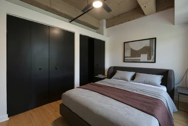 a bathroom with a granite countertop sink and a large mirror
