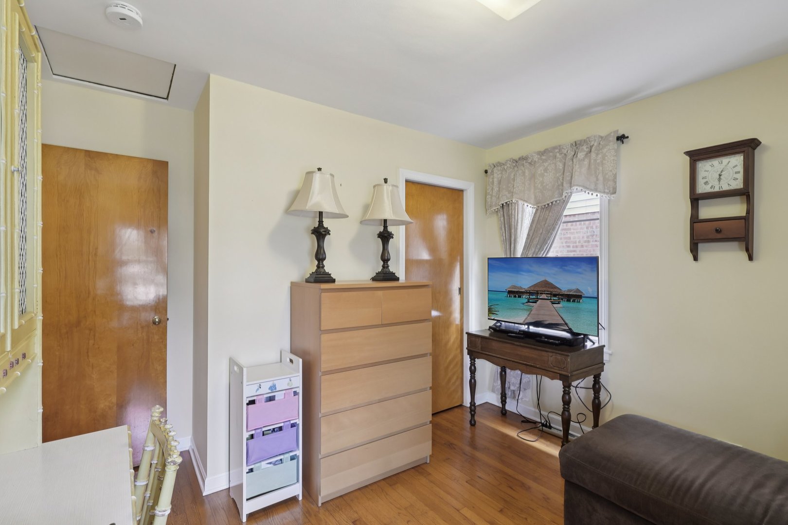 1034 31st Avenue Bellwood, IL 60104 - Photo 13 of 30 a room with a dresser and a mirror