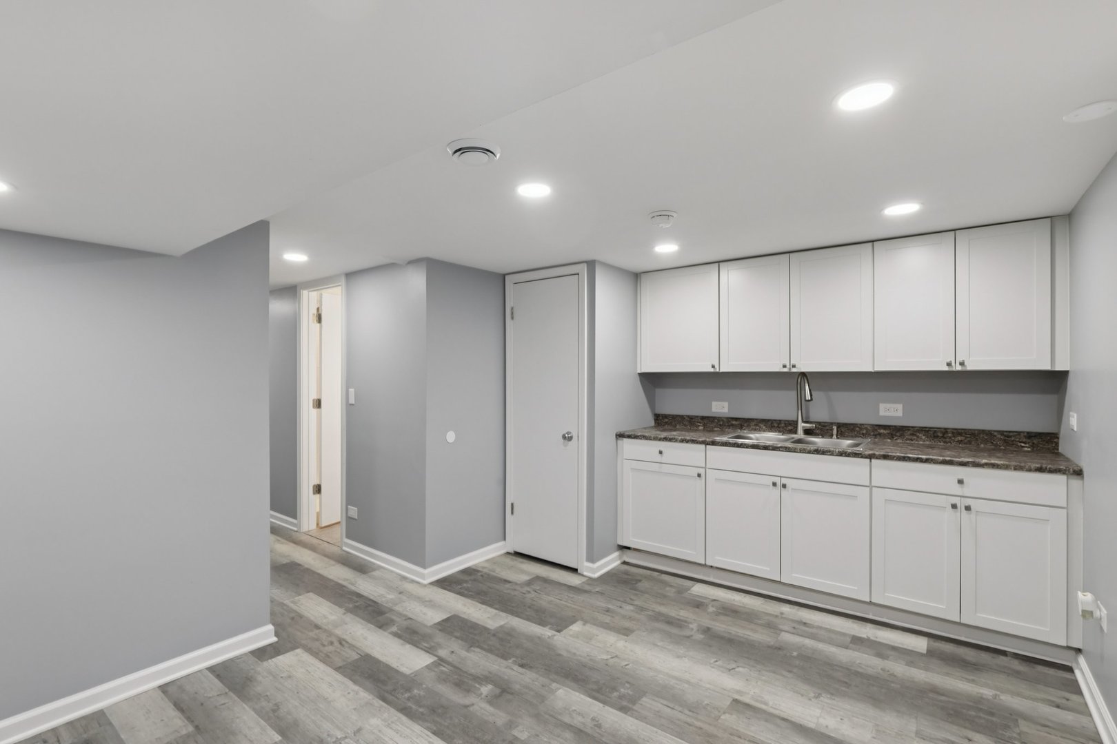 1034 31st Avenue Bellwood, IL 60104 - Photo 14 of 30 a kitchen with granite countertop a sink and cabinets