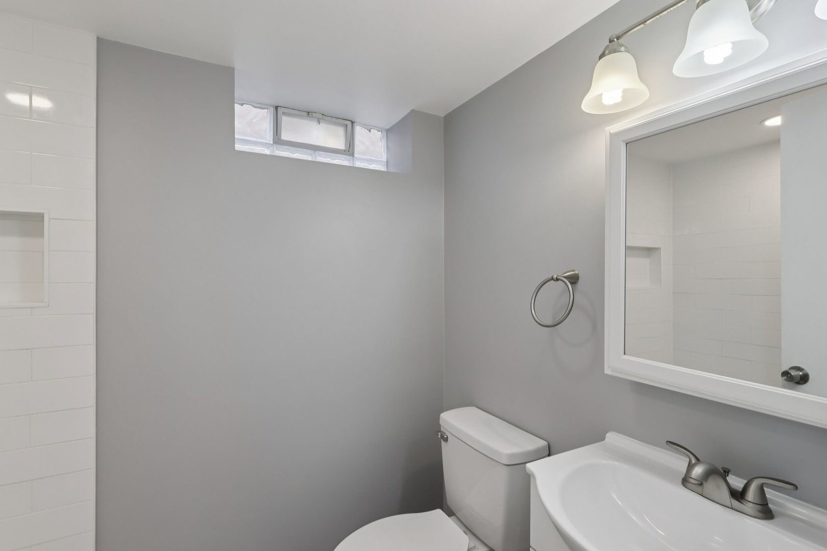 1034 31st Avenue Bellwood, IL 60104 - Photo 23 of 30 a white toilet sitting next to a bathroom sink