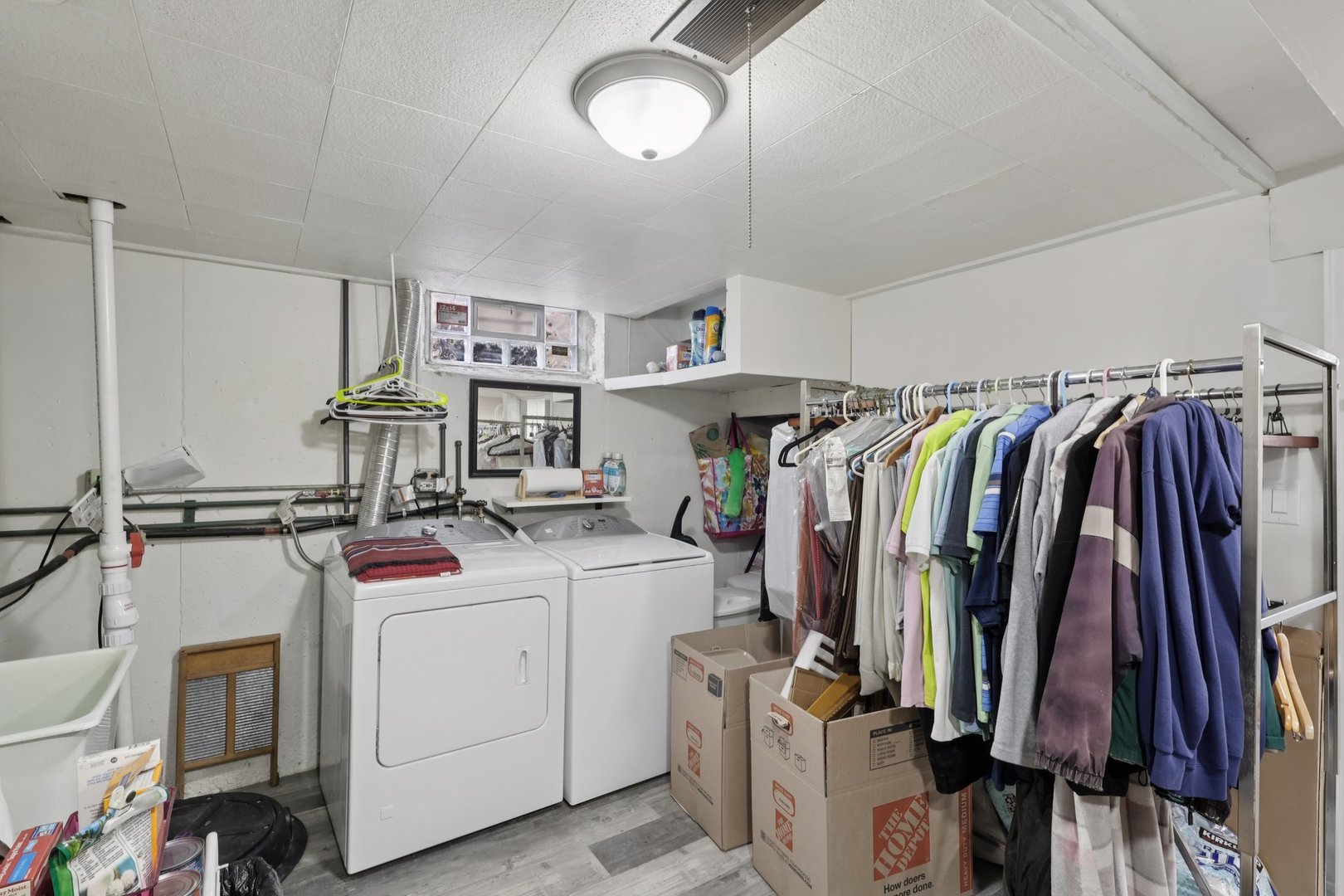 1034 31st Avenue Bellwood, IL 60104 - Photo 24 of 30 a view of walk in closet with clothes and shoes