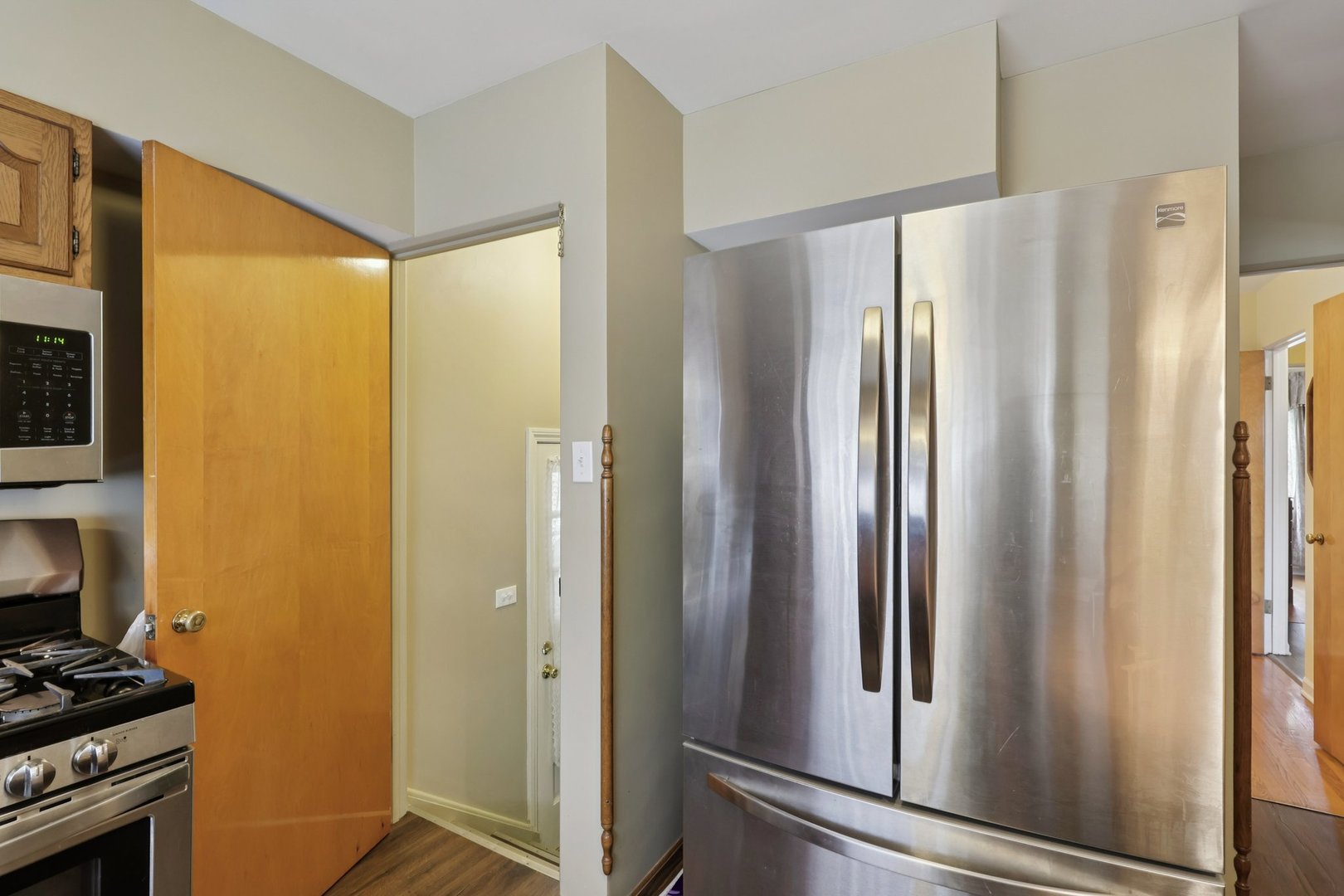 1034 31st Avenue Bellwood, IL 60104 - Photo 5 of 30 a metallic refrigerator freezer sitting in a kitchen