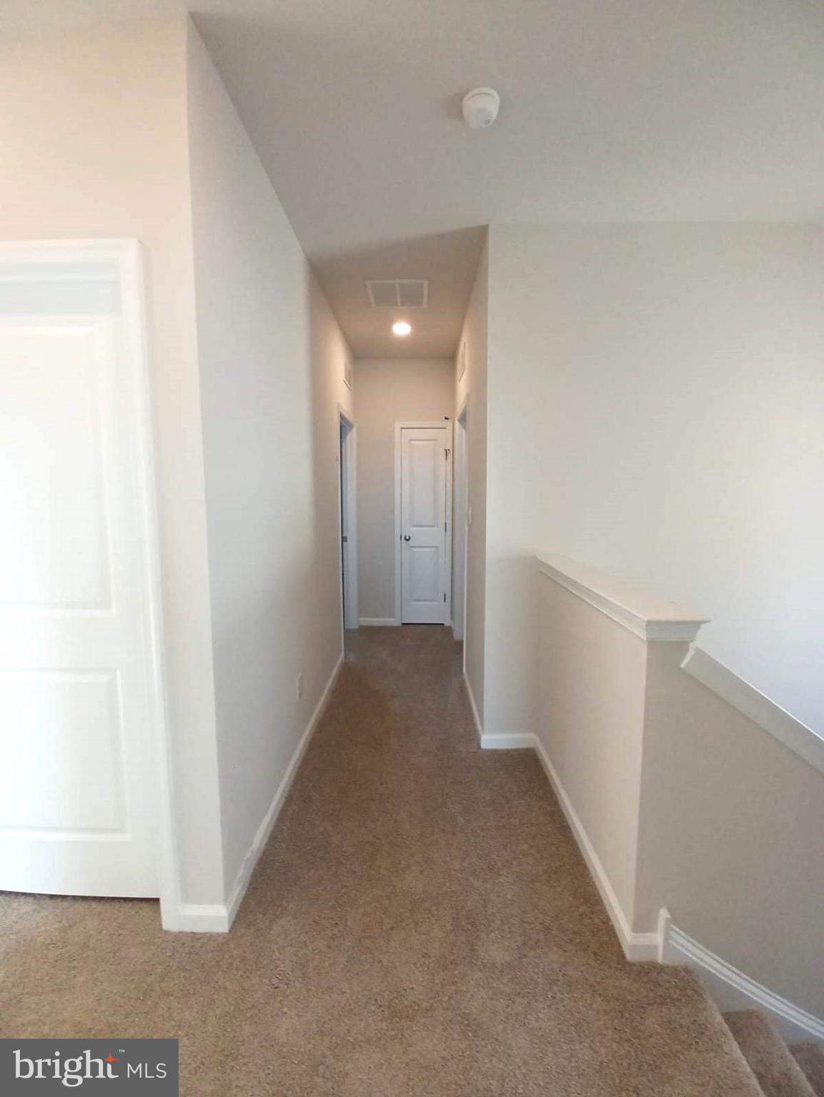 112 Winding Road Easton, PA 18040 - Photo 22 of 33 a view of hallway hall with wooden floor