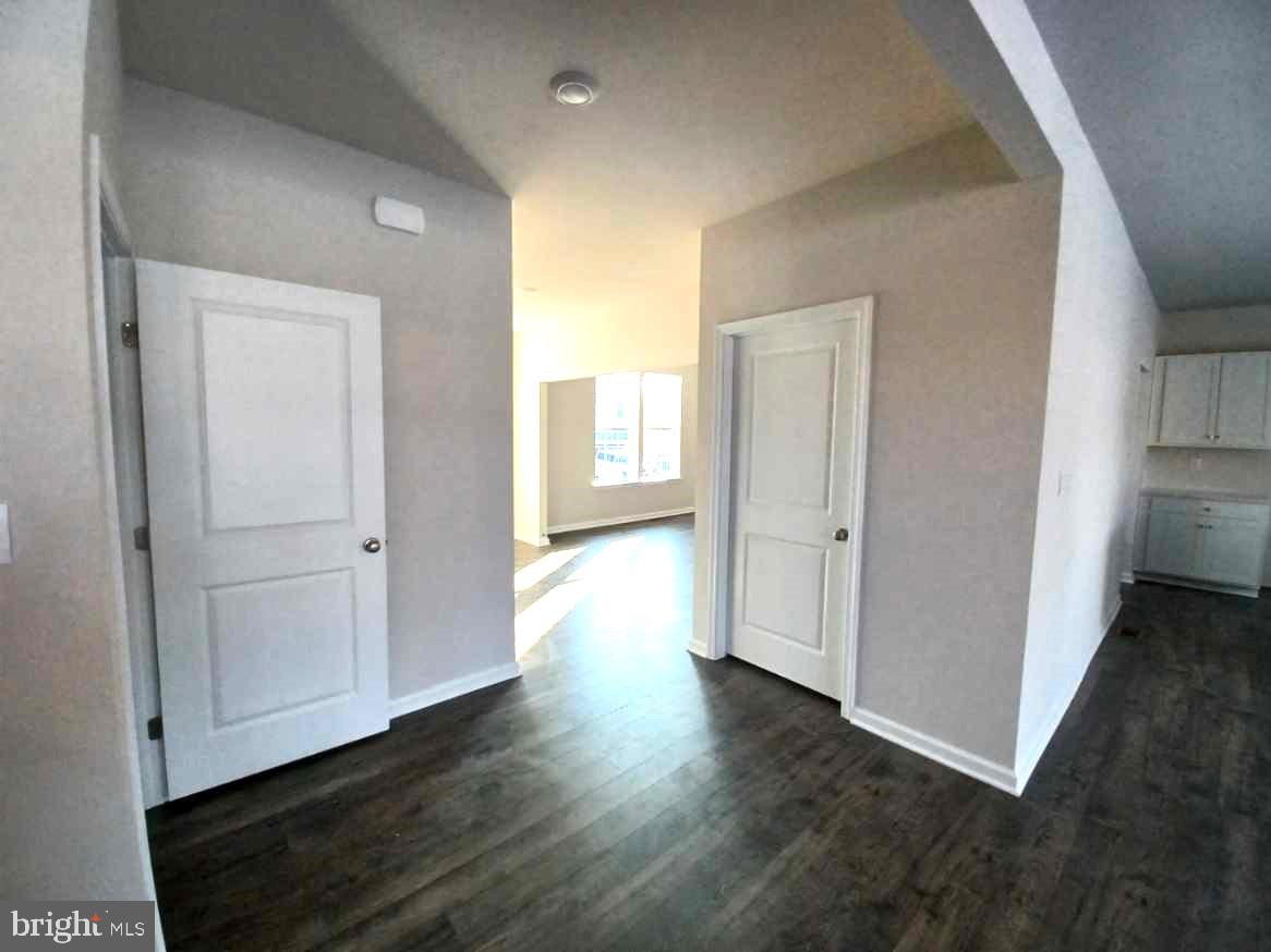 112 Winding Road Easton, PA 18040 - Photo 8 of 33 an empty room with wooden floor & windows