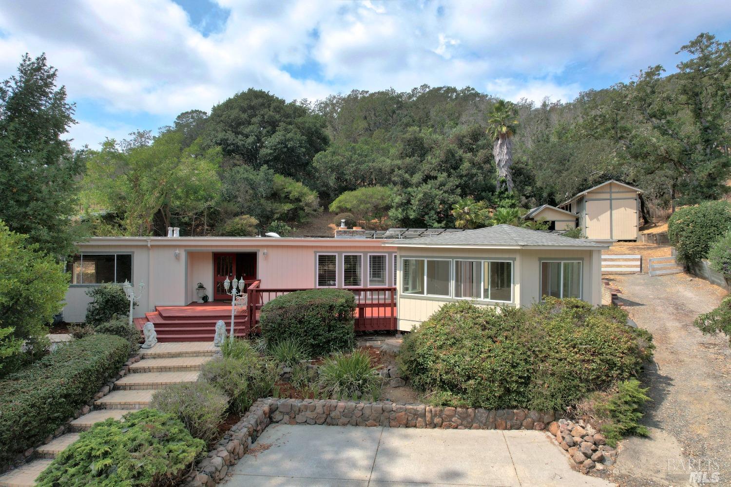a front view of house with yard and green space