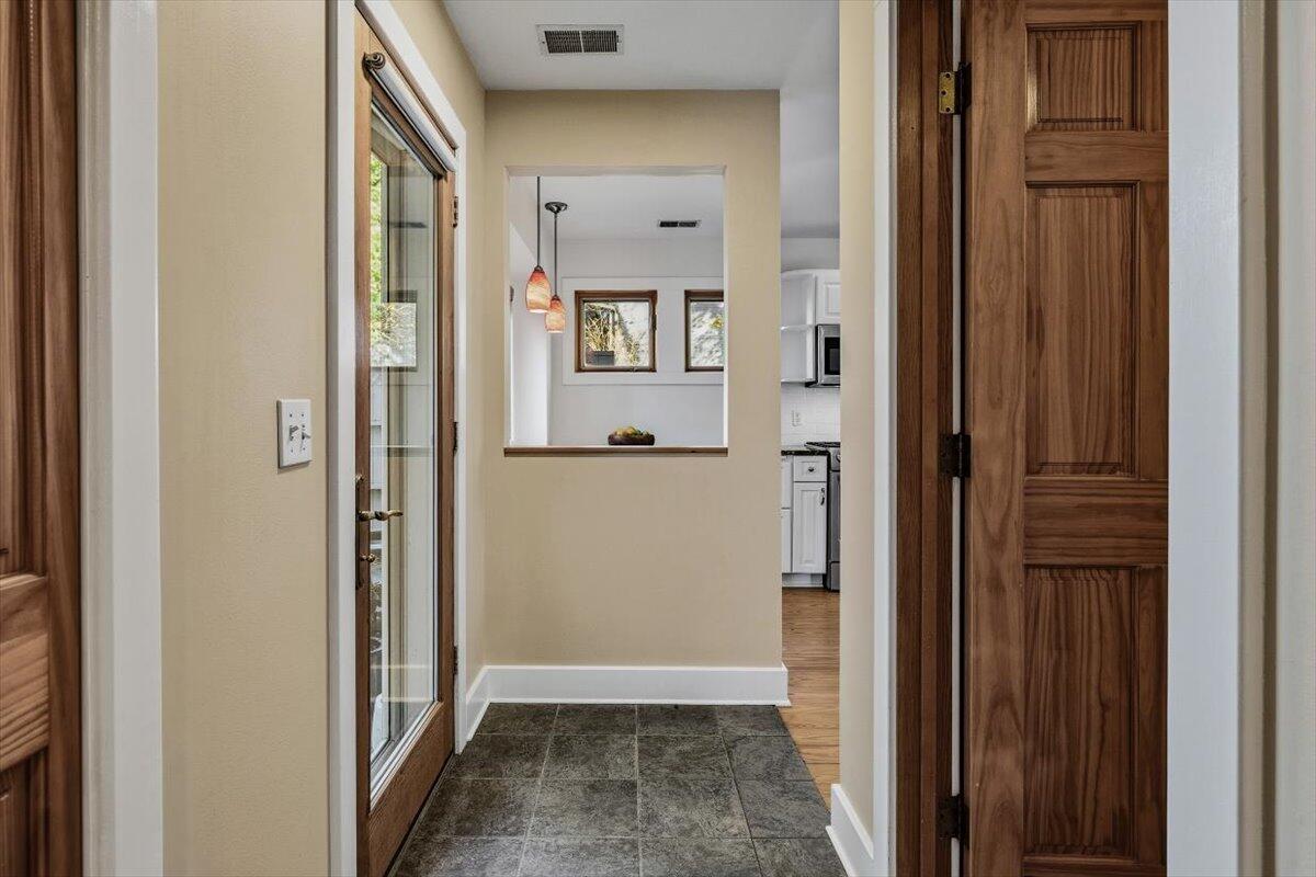 24 Tryon Farm Lane Michigan City, IN 46360 - Photo 14 of 44 a view of a hallway with wooden floor and a livingroom