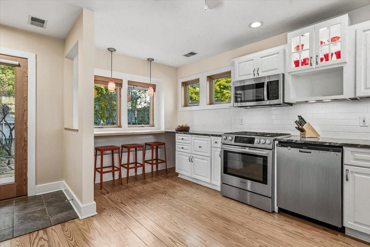 24 Tryon Farm Lane Michigan City, IN 46360 - Photo 15 of 44 a kitchen with stainless steel appliances granite countertop a stove and a sink