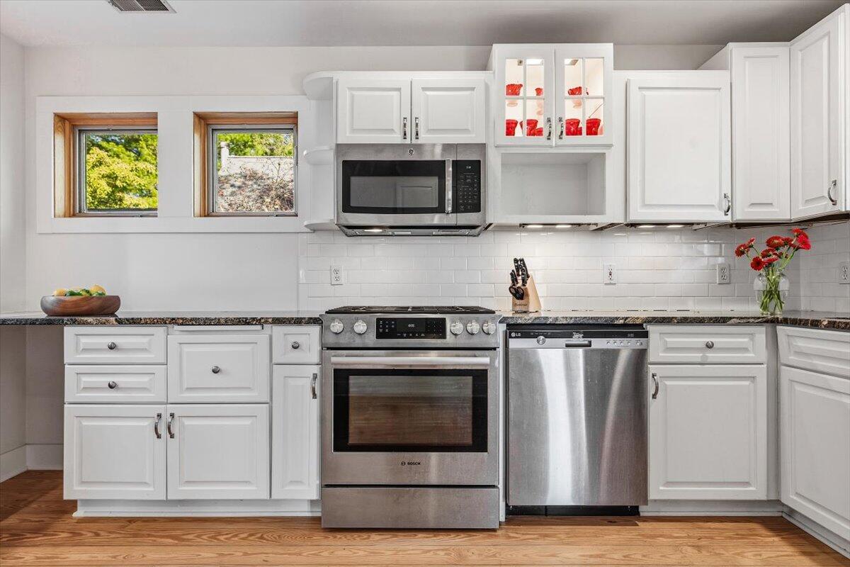24 Tryon Farm Lane Michigan City, IN 46360 - Photo 17 of 44 a kitchen with stainless steel appliances granite countertop a stove and a microwave