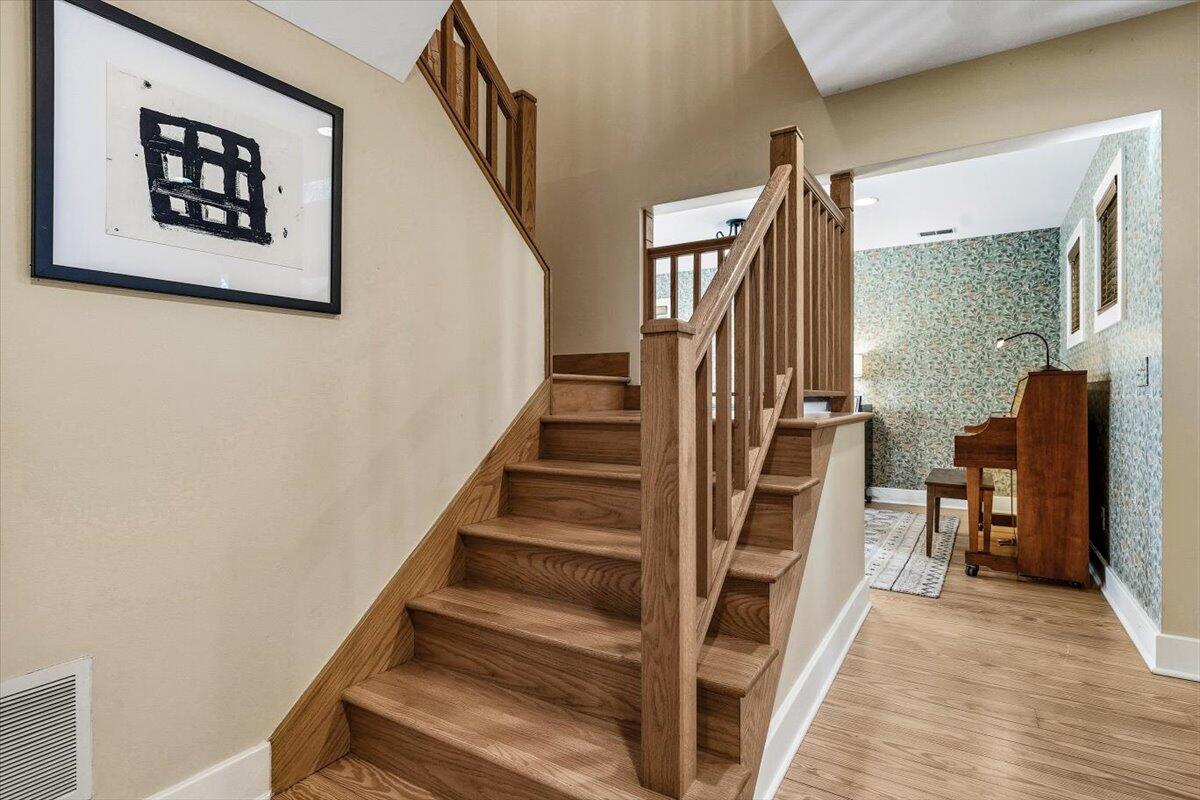 24 Tryon Farm Lane Michigan City, IN 46360 - Photo 20 of 44 a view of staircase with wooden floor and furniture