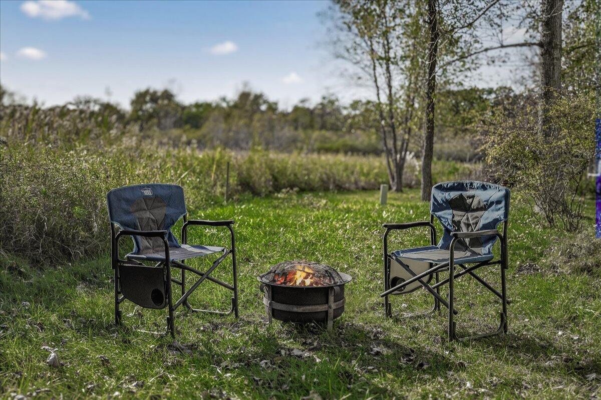 24 Tryon Farm Lane Michigan City, IN 46360 - Photo 36 of 44 a backyard of a house with table and chairs