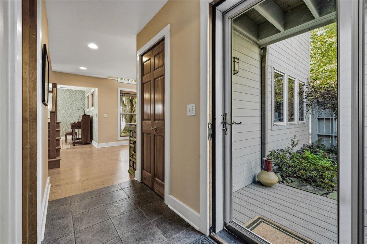 24 Tryon Farm Lane Michigan City, IN 46360 - Photo 4 of 44 a view of a hallway with wooden floor and a yard